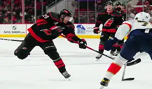Carolina Hurricanes player takes a shot on goal during a February 25, 2024, game against the Buffalo Sabres.