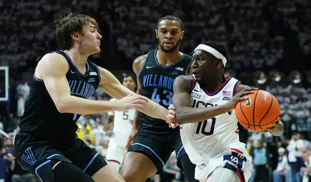Villanova Wildcats defend against a Georgetown Hoyas player driving to the basket during their February 27, 2024 matchup.