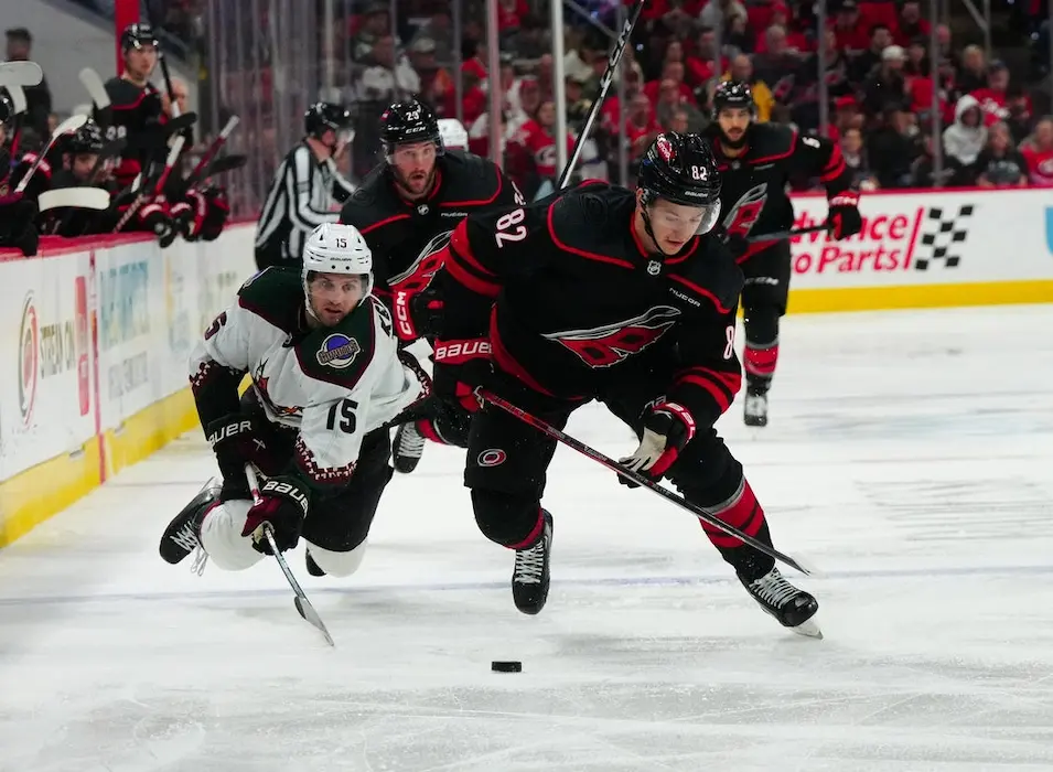 NHL 10 carolina hurricane splayers sliding to puck