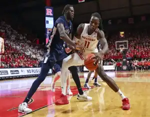 Rutgers and Penn State players battle for possession during their February 3, 2024 NCAA basketball matchup