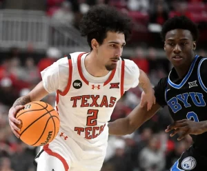 texas tech player holding the ball