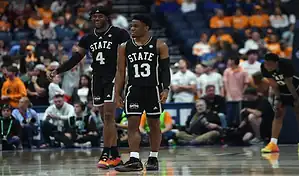 Mississippi State Bulldogs basketball players on court during game against Auburn Tigers, March 16, 2024