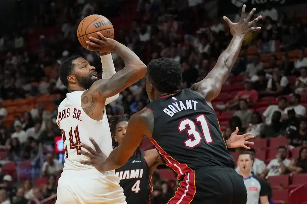 9 Miami Heat's Gabe Vincent (31) defends against Denver Nuggets' Jamal Murray (24) during a basketball game.