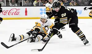 A thrilling moment during the Boston Bruins vs. St. Louis Blues game on March 11th, 2024, with intense action on the ice.