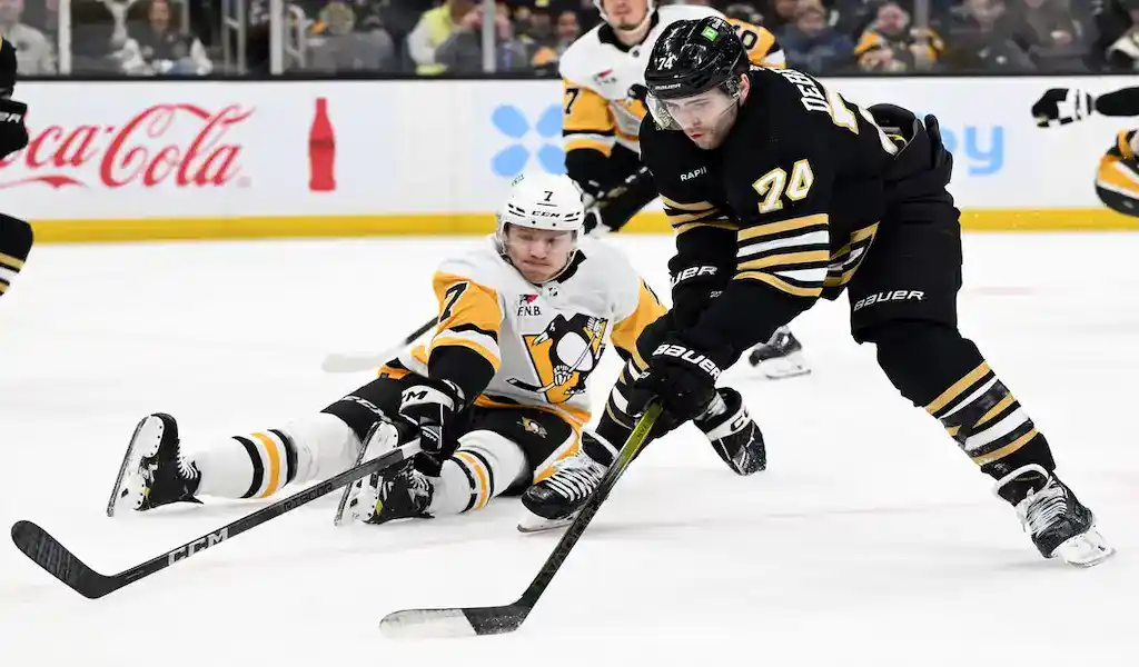 A thrilling moment during the Boston Bruins vs. St. Louis Blues game on March 11th, 2024, with intense action on the ice.