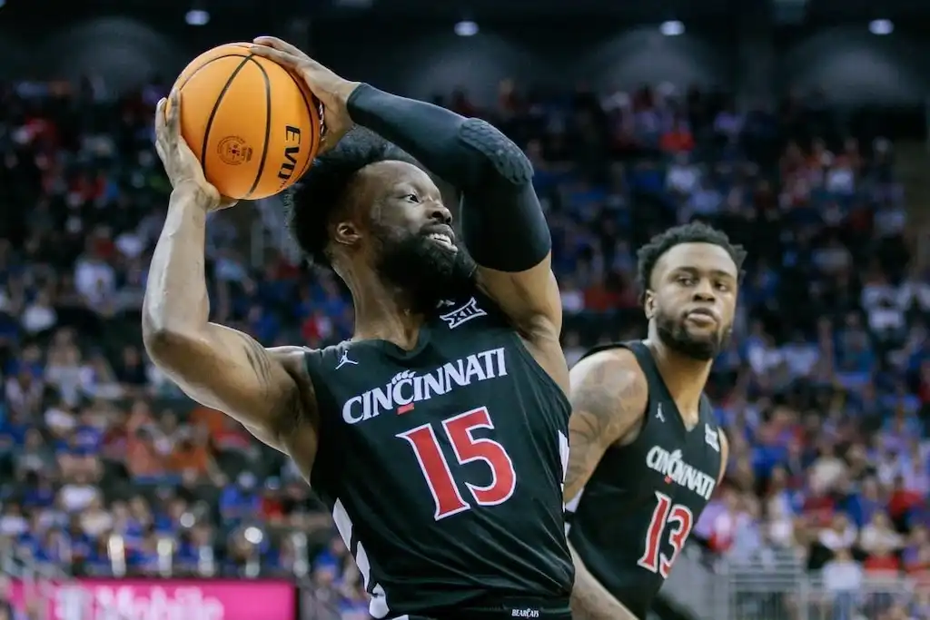 NCAAB 1 A Cincinnati Bearcats basketball player prepares to make a pass.