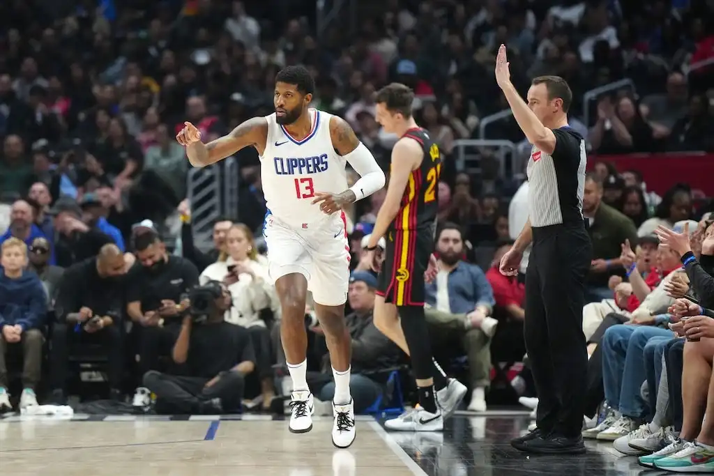 Los Angeles Clippers player Paul George reacts after a play near the sideline.