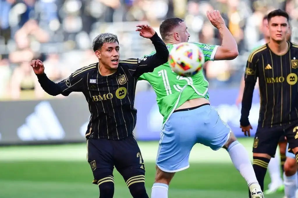 An LAFC player reacts during a physical play.