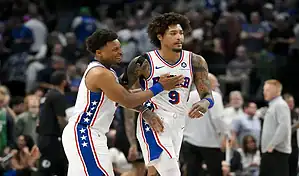 Brooklyn Nets and Philadelphia 76ers players in action during an intense NBA matchup on March 5, 2024, showcasing fast-paced play and competitive spirit on the court.