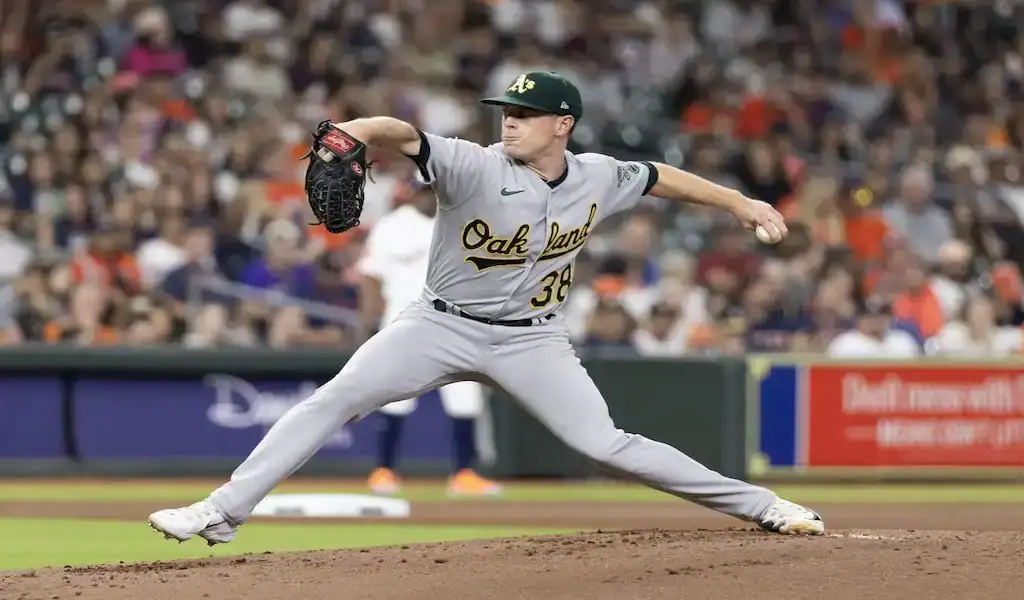 9 Oakland Athletics pitcher throws a pitch during a March 30, 2024, game against the Cleveland Guardians.