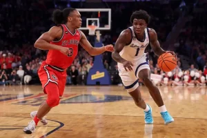 A Seton Hall player drives past a defender during a fast break.