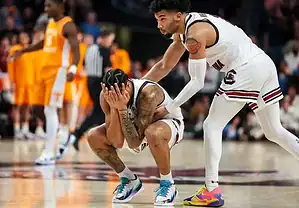 College basketball player in a white uniforM