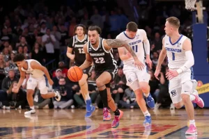 ncaab providence player running from creighton players