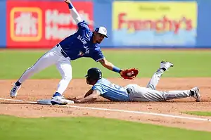 Toronto player, catching the baseball to make an out