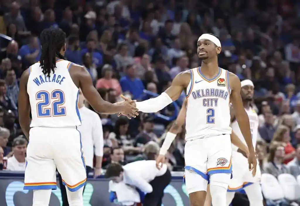 7 Oklahoma City Thunder teammates shake hands.