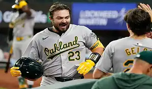 Oakland Athletics player celebrates after a hit during a game against the Texas Rangers on April 10, 2024.