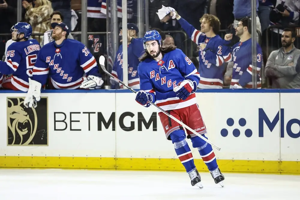 NHL 7 new york rangers nhl player sliding on the field