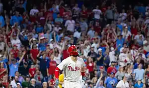 Philadelphia Phillies batter looks up while running the bases as the home crowd celebrates a big play at Citizens Bank Park.