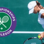 A tennis player in a white outfit prepares to serve on a green court, with the Wimbledon Championships logo in the corner.