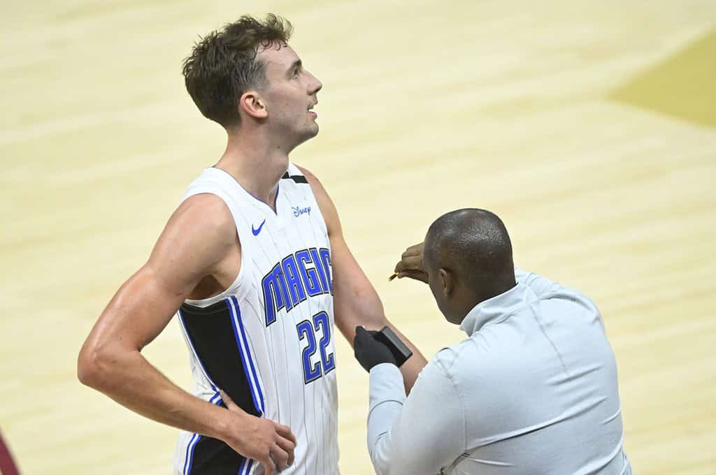 MAgic player being coached
