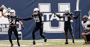 utah state players standing in a line