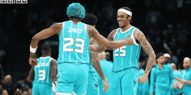 Charlotte Hornets vs Chicago Bulls Picks and Predictions December 30th 2024 3 Charlotte Hornets players Jones and teammate in teal jerseys share a celebratory moment during a game.