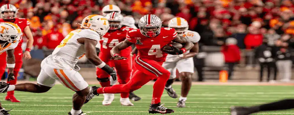 Oregon Ducks vs Ohio State Buckeyes Picks and Predictions January 1st 2025 2 Ohio State running back carries the ball against Tennessee defenders in college football game