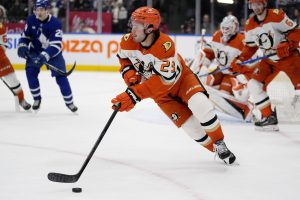 Ducks player dribbling
