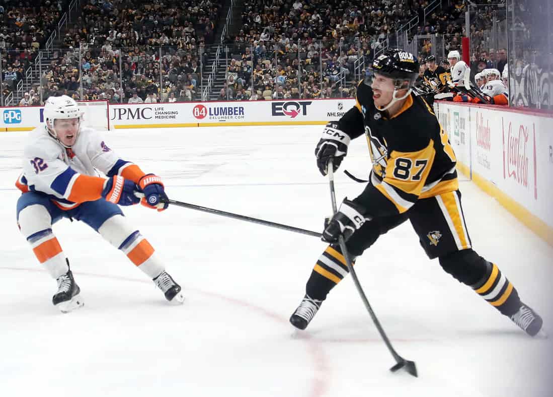 NHL 5 Penguins Player Shooting the puck