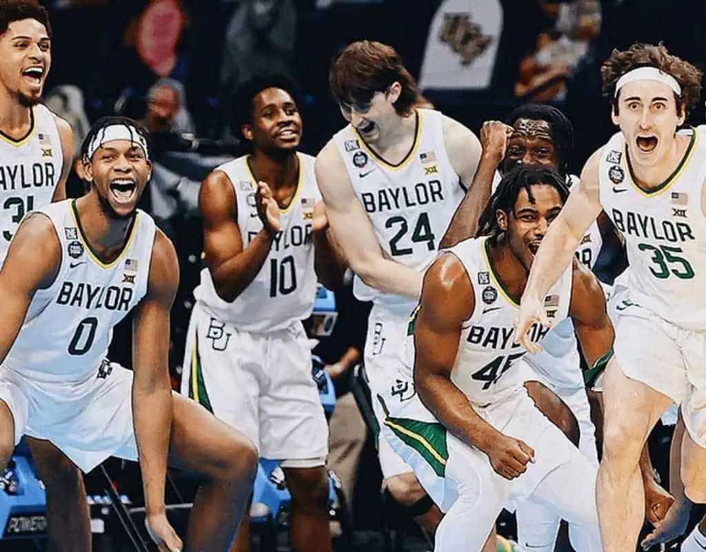 Byu Cougars vs Baylor Bears Picks and Predictions January 28th 2025 2 Baylor basketball players celebrate intensely during a game, showcasing their team's spirit and excitement on the court.