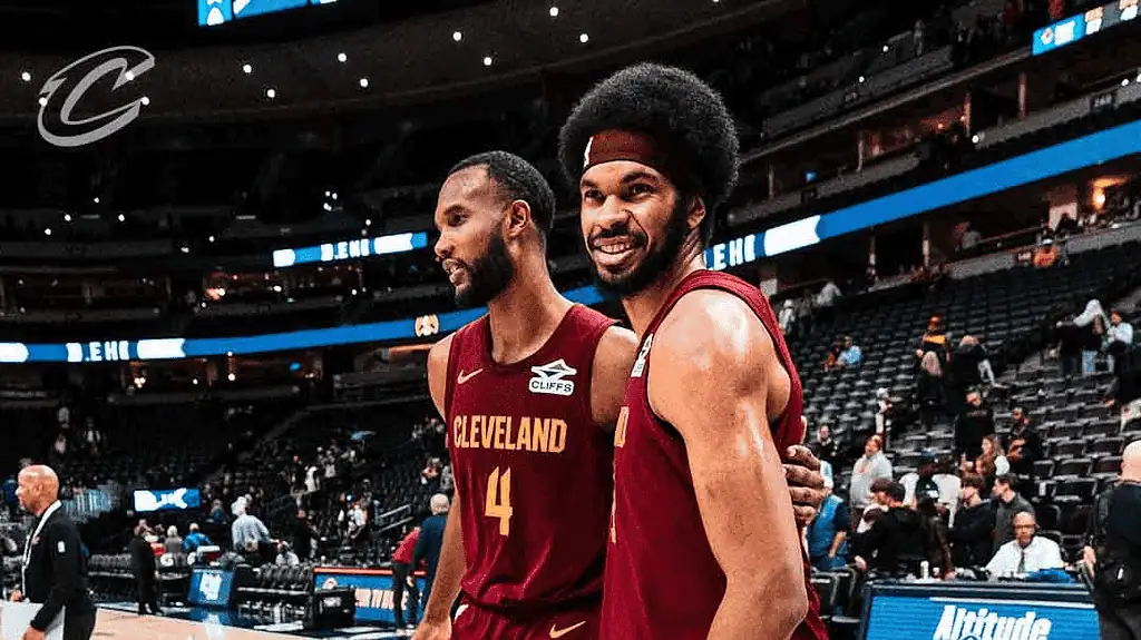 Indiana Pacers vs Cleveland-cavaliers Picks and Predictions January 14th 2025 3 Two basketball players in red Cleveland Cavaliers jerseys pose together on a court filled with fans and team staff.