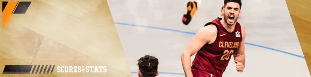 Cleveland-cavaliers vs Atlanta Hawks Picks and Predictions January 30th 2025 3 Cleveland Cavaliers basketball player wearing a maroon jersey with number 20 passionately celebrates a play on the court during a game.