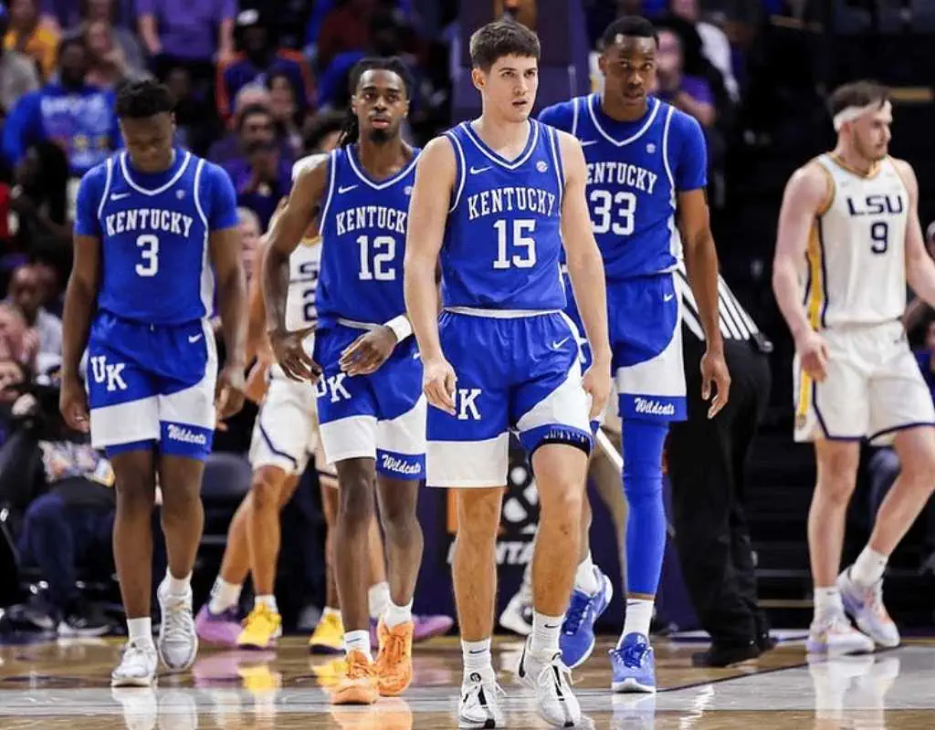 Tennessee Volunteers vs Kentucky Wildcats Picks and Predictions January 28th 2025 2 Four Kentucky basketball players, dressed in blue uniforms, walk confidently on the court during a game against LSU.