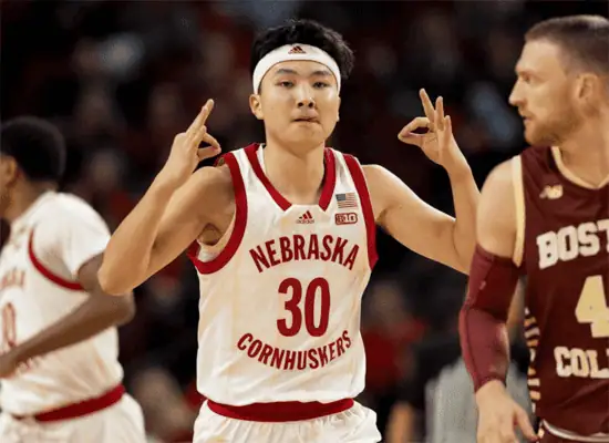 Maryland Terrapins vs Nebraska Cornhuskers Picks and Predictions January 19th 2025 2 Nebraska Cornhuskers player flashes a celebration gesture during a game against Boston College, wearing a white and red uniform