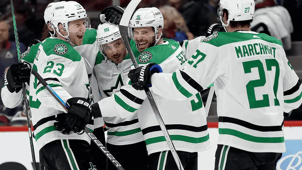 Dallas Stars vs Montréal Canadiens Picks and Predictions January 16th 2025 2 A group of Dallas Stars players in white jerseys celebrate a goal on the ice, showcasing camaraderie and excitement in a hockey game.