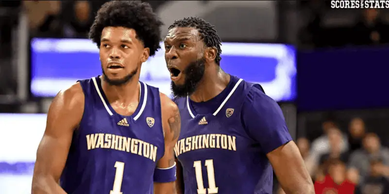Washington Huskies vs Illinois Fighting Illini Picks and Predictions January 5th 2025 2 Two Washington Huskies basketball players in purple jerseys reacting emotionally during a college basketball game.