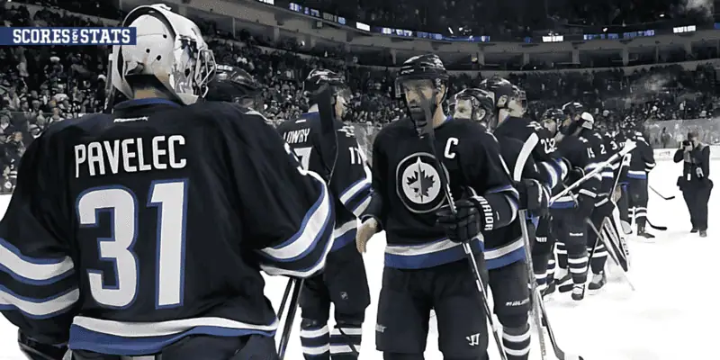 Winnipeg Jets vs Nashville Predators Picks and Predictions January 7th 2025 2 Winnipeg Jets players, including goalie Pavelec and captain, line up for postgame handshakes on the ice after a win