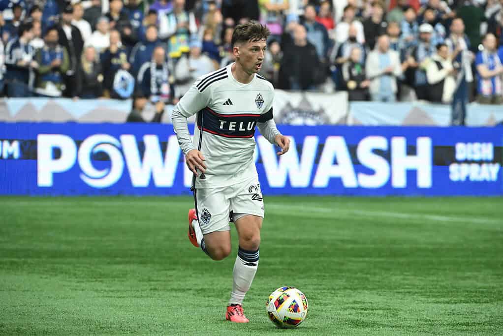 White caps player dribbling