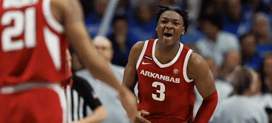 Arkansas Razorbacks vs Alabama Crimson Tide Picks and Predictions February 8th 2025 2 Arkansas Razorbacks basketball player wearing jersey number 3 reacts energetically during a game