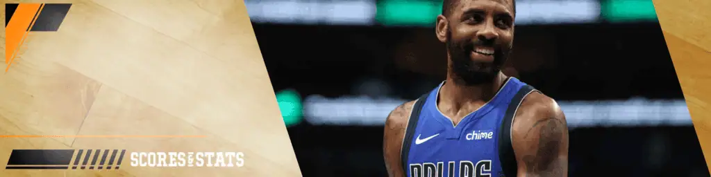 Dallas Mavericks vs Golden State Warriors Picks and Predictions February 12th 2025 3 Kyrie Irving in a blue Dallas Mavericks jersey smiling on the court during a game