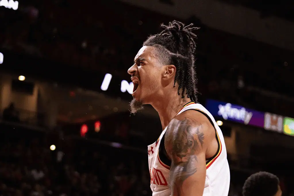 Penn State Lady Lions vs Maryland Terrapins Picks and Predictions March 1st 2025 2 A basketball player with a stylish hairstyle and visible tattoos celebrates on the court during
