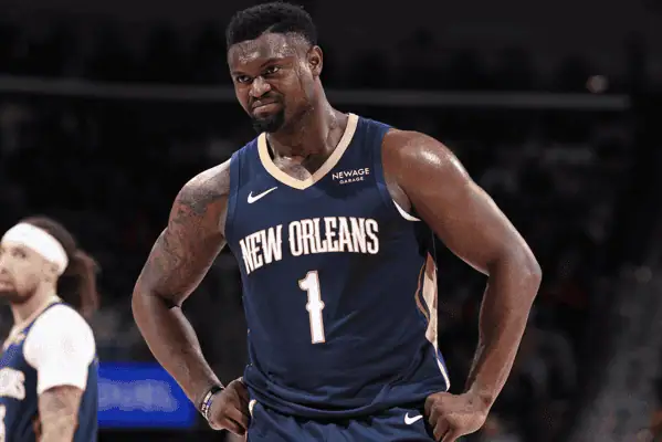 Phoenix-suns vs New Orleans Pelicans Picks and Predictions February 27th 2025 3 Zion Williamson in a New Orleans Pelicans jersey, standing with hands on hips and a determined look during a game.
