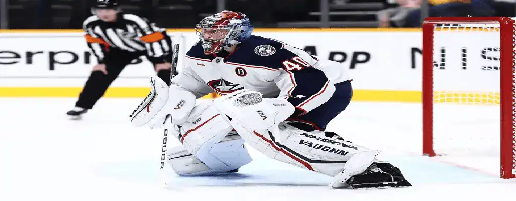 Columbus Blue Jackets goalie ready to make a save during NHL game