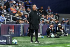 Earthquakes coach looking at the match