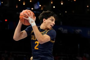 Golden Bears player Holding the ball