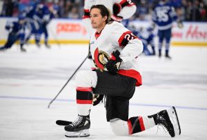 Senators player dribbling