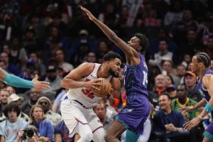 Knicks player guarding the ball