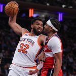 Knicks Player dunking on another player