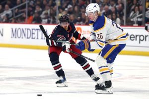 Hockey players battling for the puck