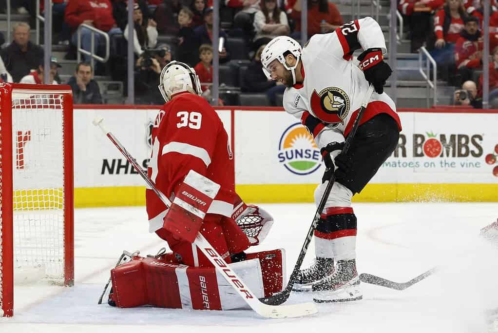 Otawa player shooting the puck